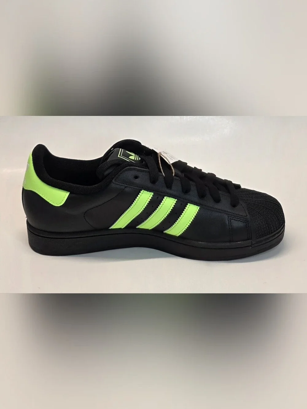 adidas Men’s Black Sneakers with Neon Green Stripes